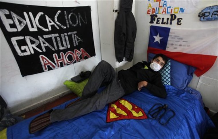 High school student Felipe Sanhueza, 18, rests inside a classroom during his hunger strike on Tuesday, along with four other students, in Buin, Chile.